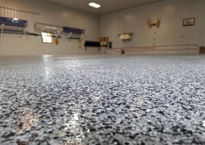 A garage with glossy concrete flooring with a textured finish in Winnipeg