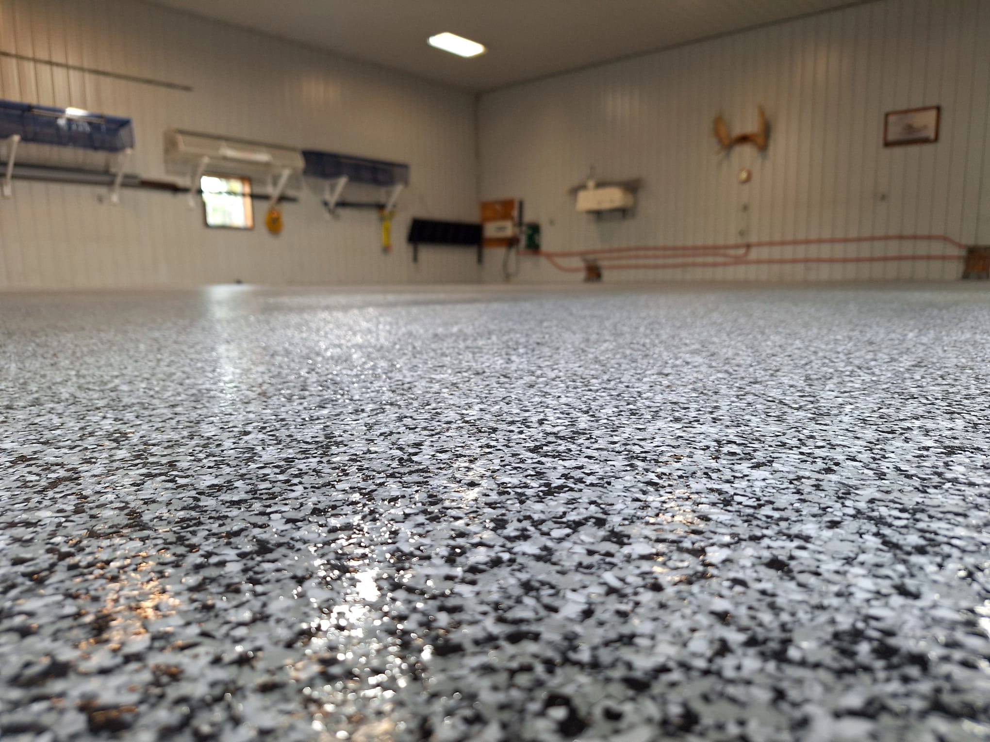 A garage with glossy concrete flooring with a textured finish in Winnipeg