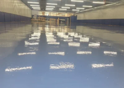 Commercial concrete flooring specialists finishing a high-quality project in Winnipeg.