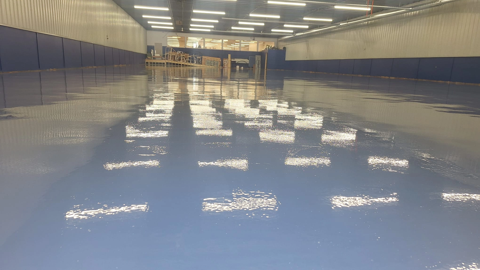 Commercial concrete flooring specialists finishing a high-quality project in Winnipeg.